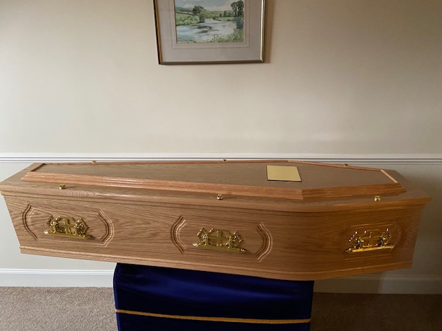 Light oak raised lid panelled side cremation coffin
