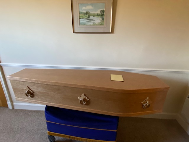 Light oak cremation coffin with solid oak handles